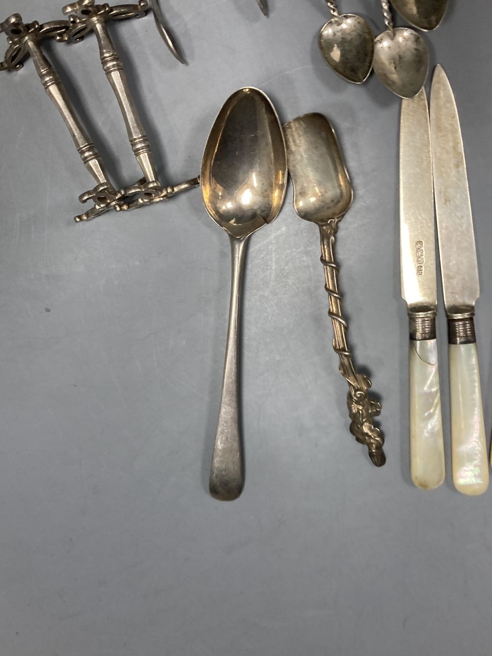 Six pairs of George V mother of pearl handled silver fruit eaters, Sheffield, 1933, etc.
